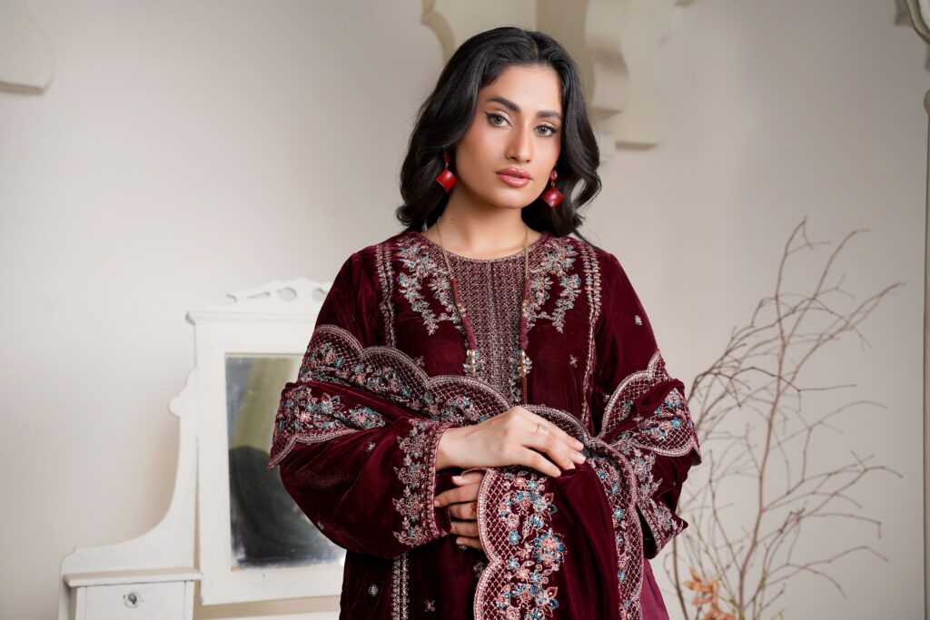 pexels photo 34688049 34688049 Model showcasing a luxurious maroon velvet eastern dress with intricate embroidery indoors.